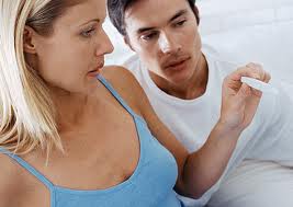 couple looking at pregnancy test